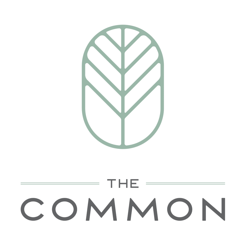 Logo of "the common" featuring a stylized leaf icon in white on a dark green background with the brand name below in white.